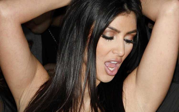 Kim Kardashian mouth open.